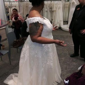Wedding dress that was never worn. Only for purchase and fitting day.
